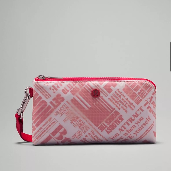 lululemon athletica Handbags - Lululemon Curved Wristlet Manifesto Print